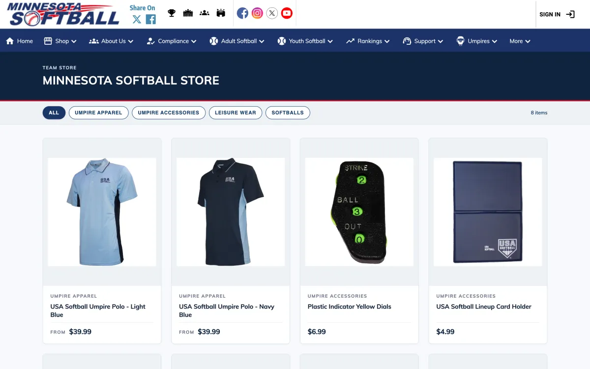 The Minnesota Softball Store on its Register Play site: Shop in the site menu, category filters, and umpire polos, an indicator and a lineup card holder with prices.